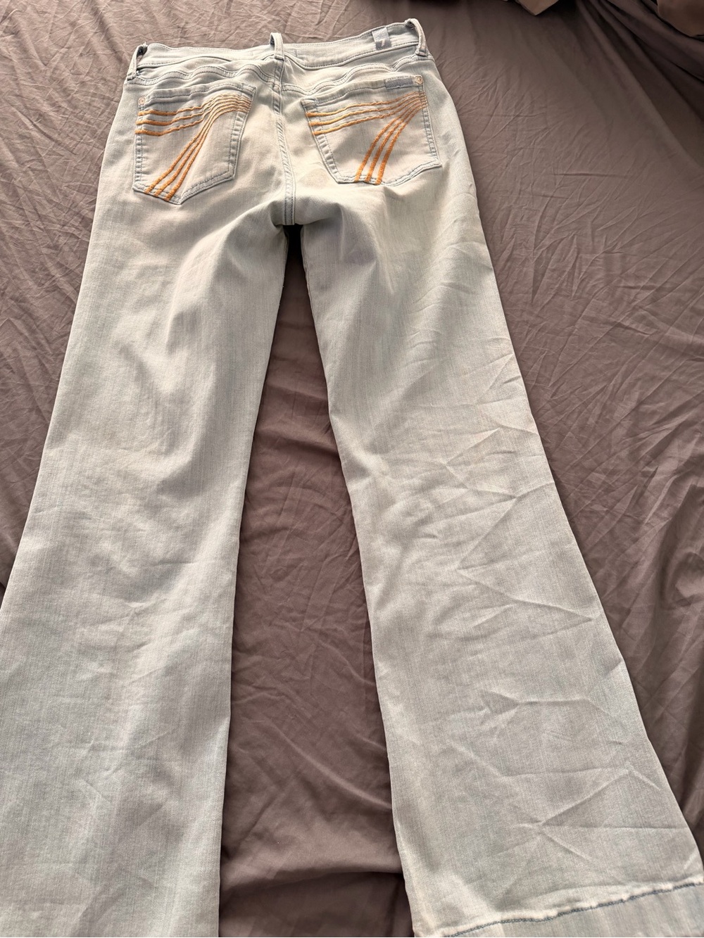 7 For All Mankind Light Wash Flare Jeans with Orange Pocket Stitching